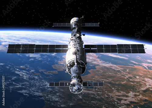 Schilderij op canvas Space Station Orbiting Earth