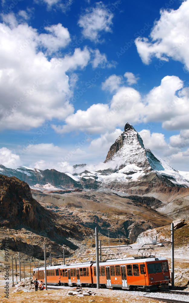 Fototapeta premium Famous Matterhorn peak with a train in Swiss Alps, Switzerland