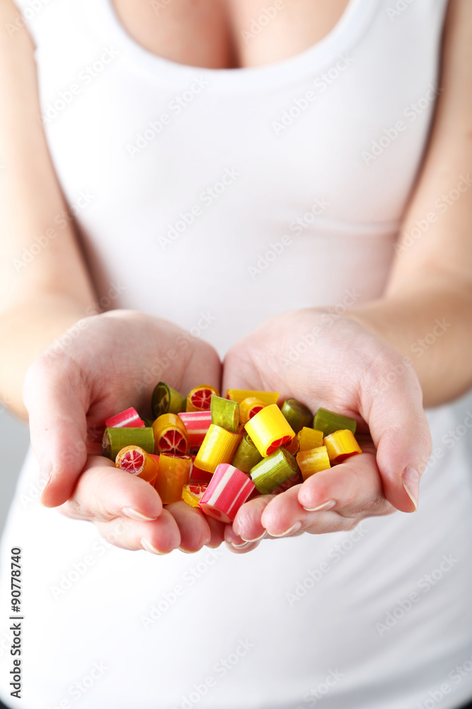 Woman's hands with candies Woman's hands with candies
