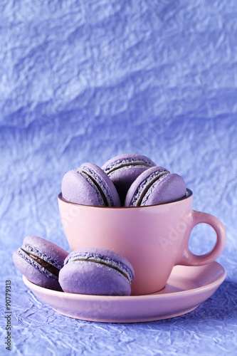 Purple macarons on paper background