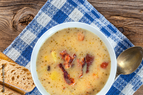 Sour soup with bread.