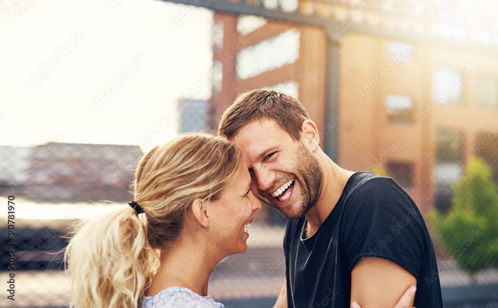 Happy spontaneous couple share a good joke Happy spontaneous couple share a good joke