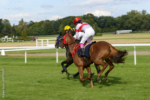 Jockey on a horse galloping to the finish of the race.