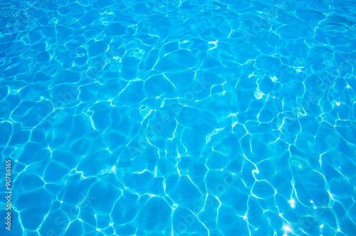 Vászonkép Blue ripped water in swimming pool