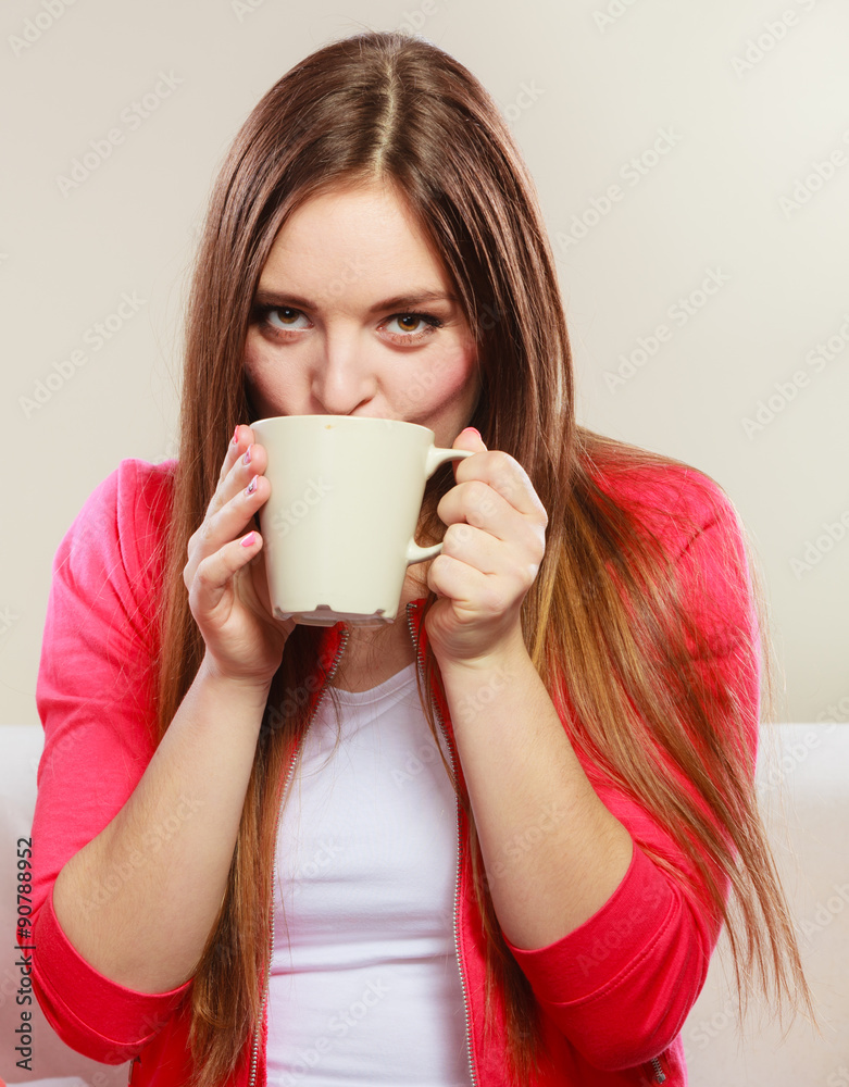 Woman drinking hot coffee beverage. Caffeine.