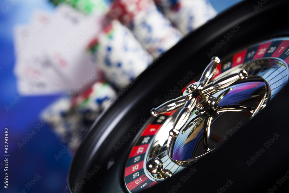 Poker Chips on a gaming with casino roulette