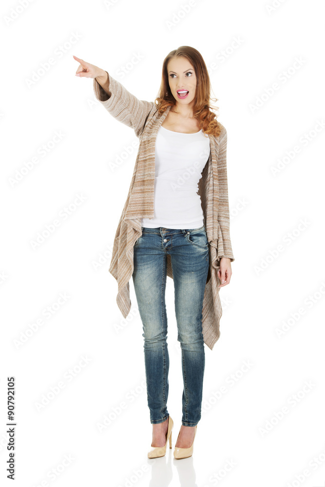Shocked woman pointing away. Shocked woman pointing away.