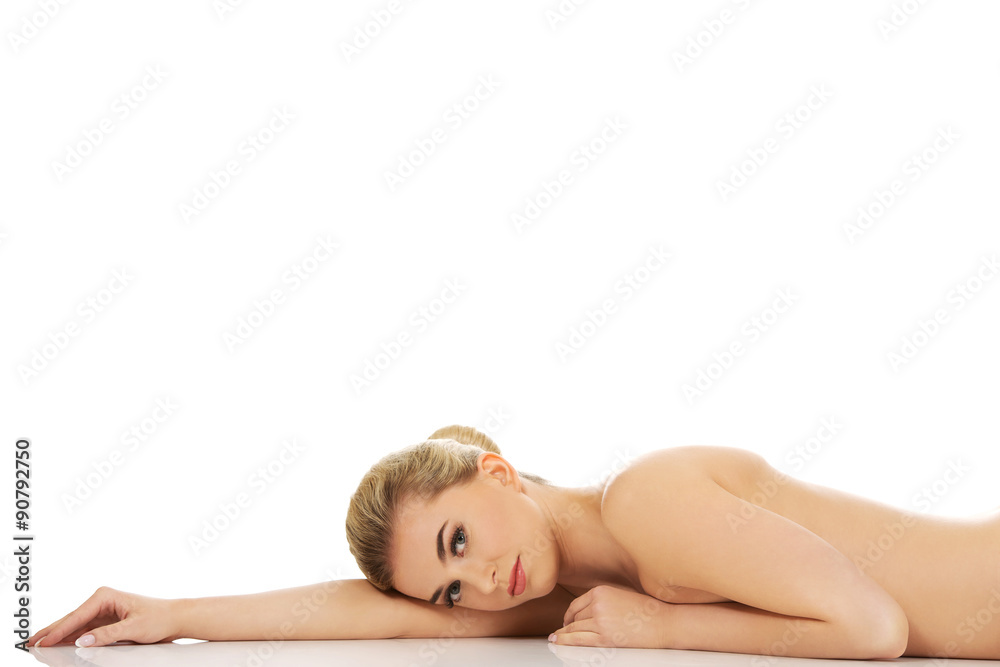 Beautiful naked woman lying on the floor. Beautiful naked woman lying on the floor.