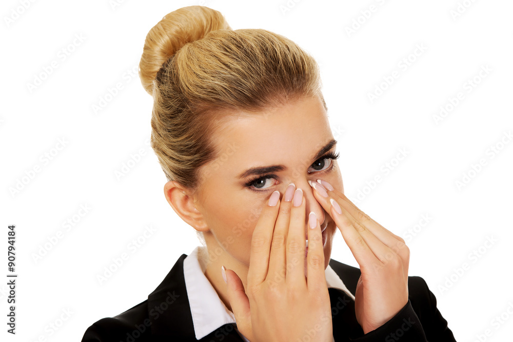 Businesswoman giggles covering her mouth with hand Businesswoman giggles covering her mouth with hand