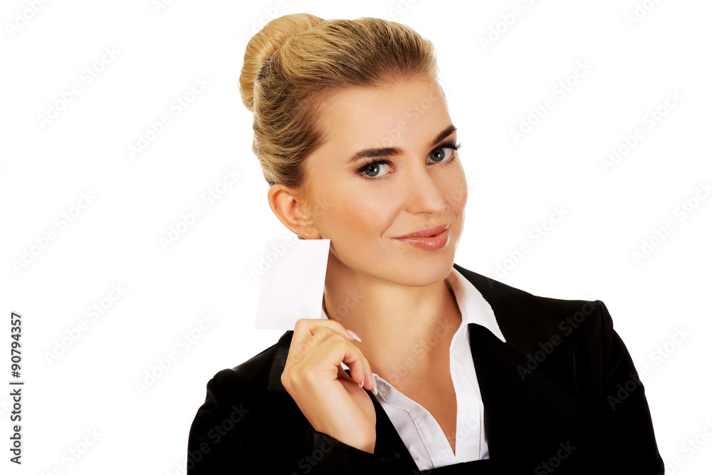 Fototapeta premium Beautiful smiling businesswoman with business card