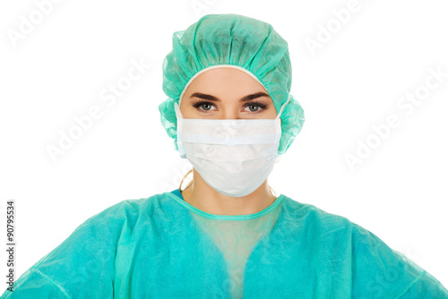 Female surgeon doctor in protective mask