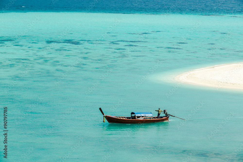 One alone boat in blue sea.