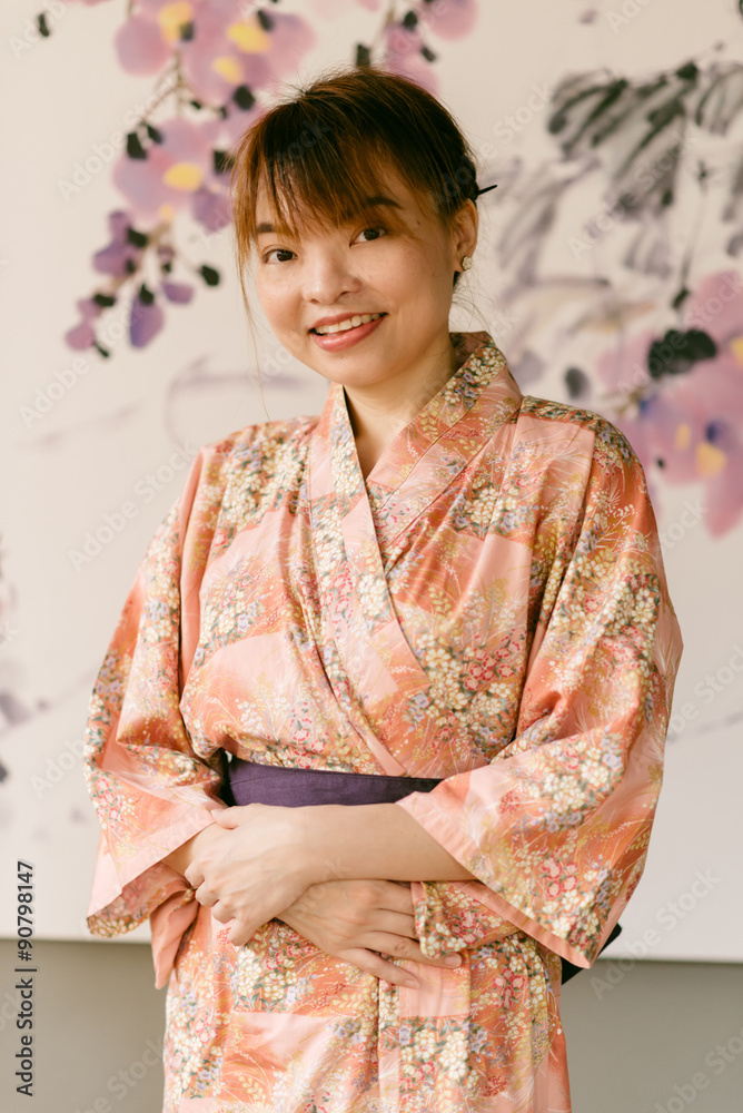 Fototapeta premium Asian woman wearing yukata in Asian garden