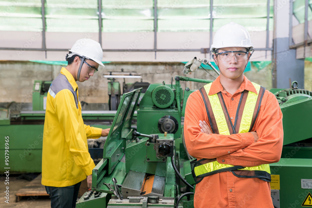 Asian Mechanical Engineer working in factory Asian Mechanical Engineer working in factory