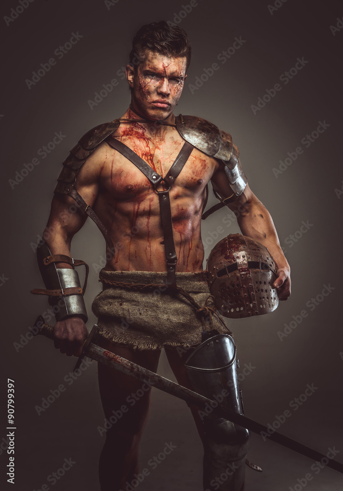 Muscular bloody gladiator with sword and helmet.