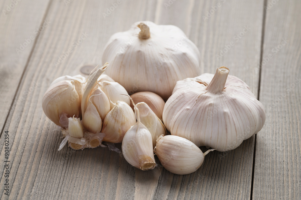 garlic on wooden table closeup garlic on wooden table closeup