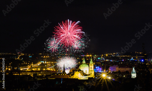 Fireworks illuminate the sky over Charles bridge, Czech Republic