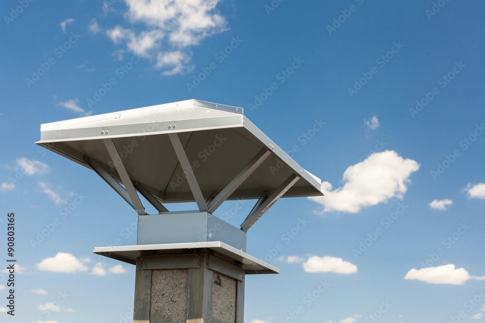New chimney (smokestack) with metal box closeup New chimney (smokestack) with metal box closeup