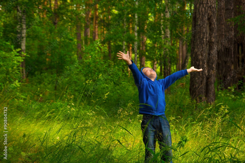 Happy child in forest (park)