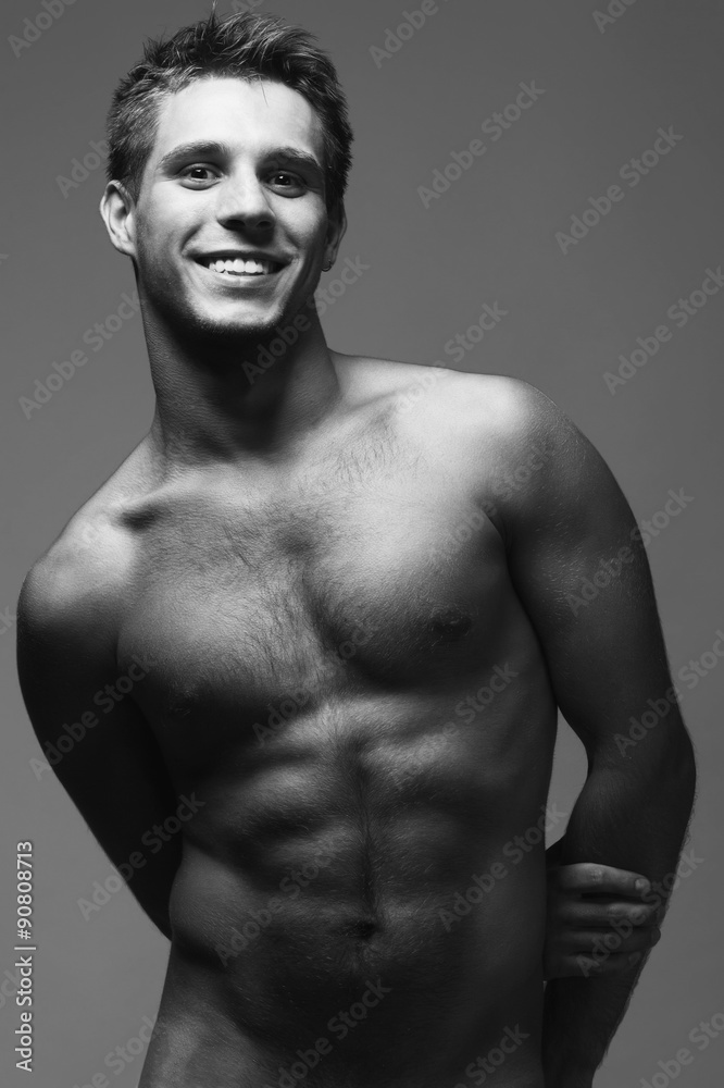 Fototapeta premium Bodybuilding and body sculpture concept. Beautiful (handsome) man