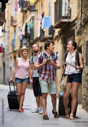 Tourists with camera and map walking