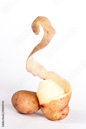 pinstripe skins peeled potato isolated on a white 