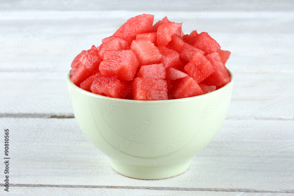 watermelon in a bowl on a wooden background watermelon in a bowl on a wooden background