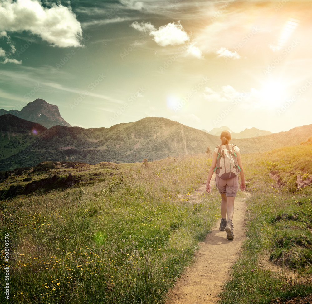 Woman Hiking on Remote Mountain Valley Trail Woman Hiking on Remote Mountain Valley Trail