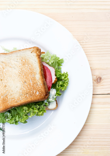 Healthy ham sandwich with cheese, tomatoes and lettuce