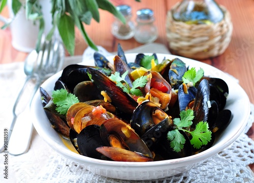 soup of wild mussels with white wine, vegetables, sage and coriander