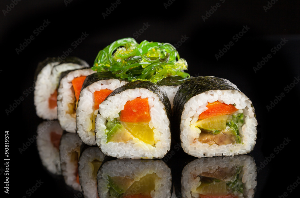 Maki sushi served on black background Maki sushi served on black background
