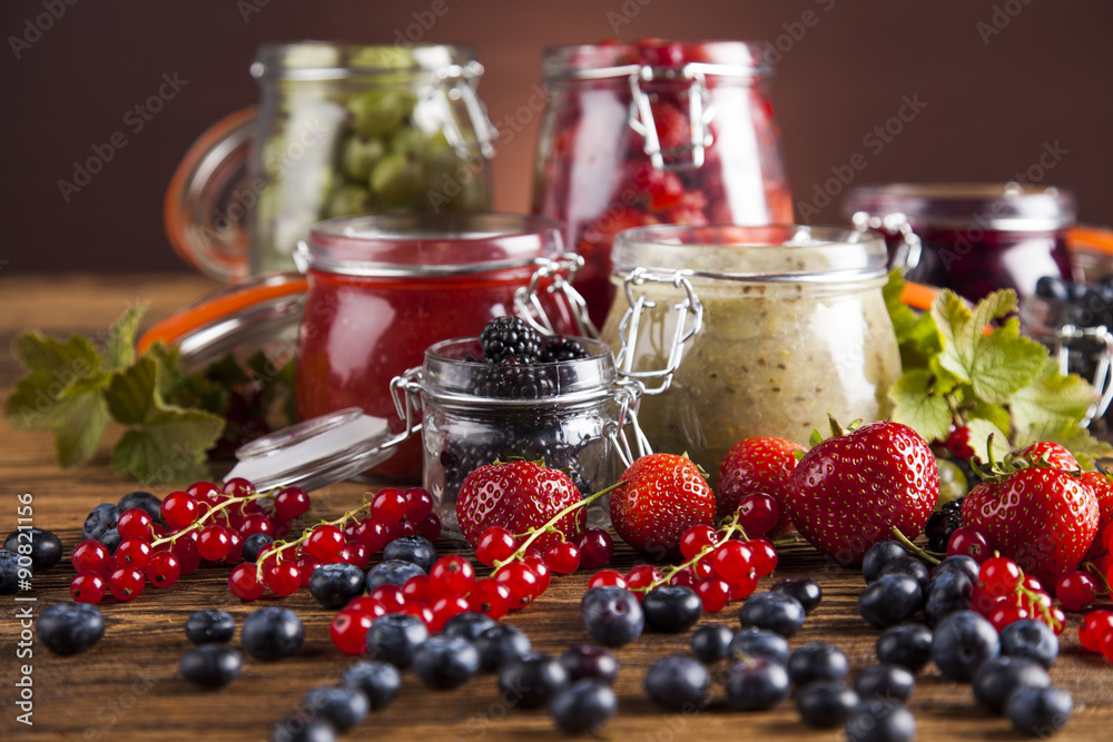 Glass of mixed berry jam with strawberries, bilberries, red currants and blackberries Glass of mixed berry jam with strawberries, bilberries, red currants and blackberries