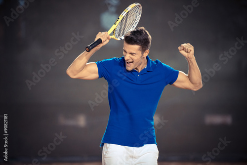 Tennis player celebrating his victory