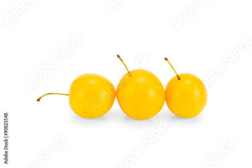 Three yellow plums - isolated on white background