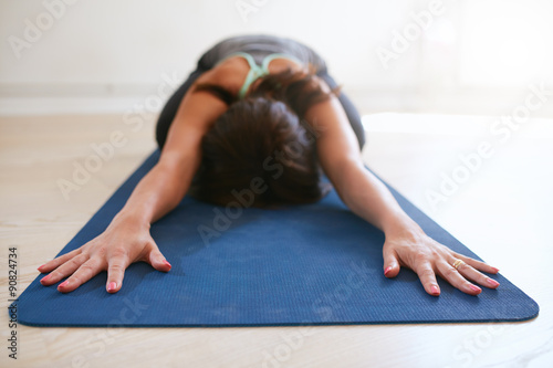 Woman doing yoga in balasana