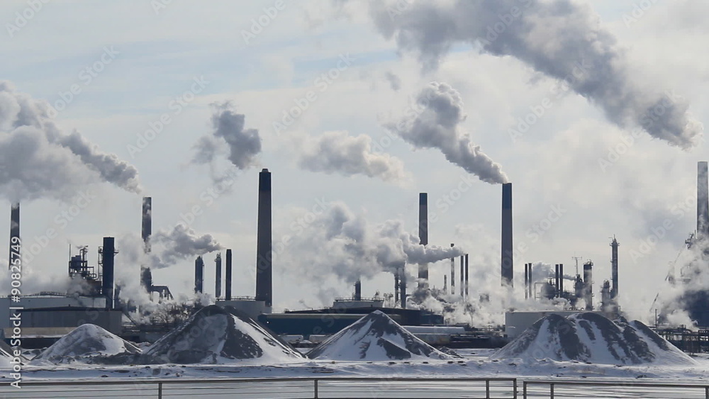 Petrochemical Refinery 1. View of a petrochemical refinery in Sarnia, Ontario, Canada. Shot from across the St. Clair River in Port Huron, Michigan on a cold winter morning. Petrochemical Refinery 1. View of a petrochemical refinery in Sarnia, Ontario, Canada. Shot from across the St. Clair River in Port Huron, Michigan on a cold winter morning.
