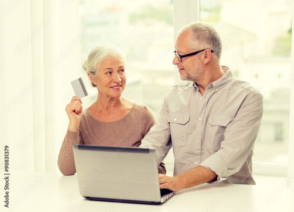 happy senior couple with laptop and credit card happy senior couple with laptop and credit card