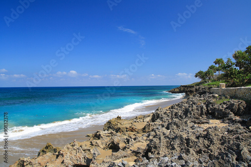 Ocean with waves and rocks on caribbean beach