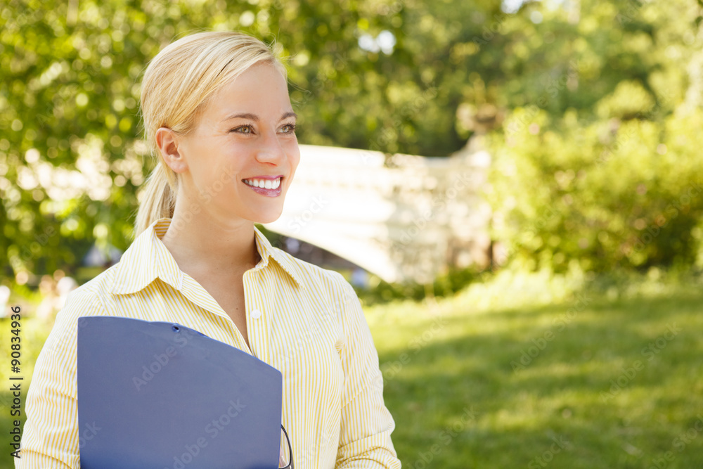 Young woman with a clipboard. Young woman with a clipboard.