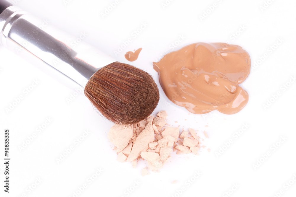 Make-up brush near eyeshadow and foundation Make-up brush near eyeshadow and foundation