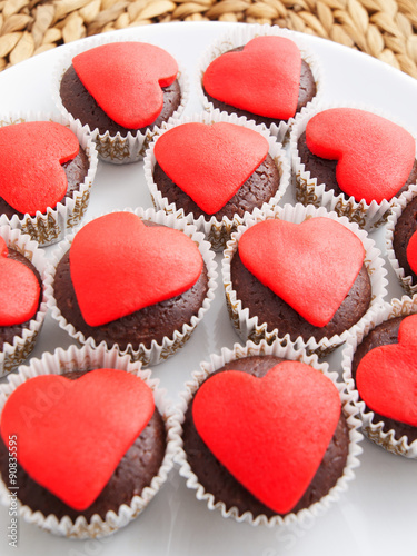 Chocolate muffins with red heart on top