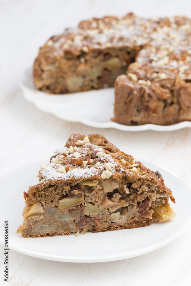 piece of homemade apple pie on white table, vertical piece of homemade apple pie on white table, vertical