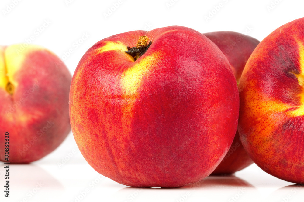 Peaches on white table