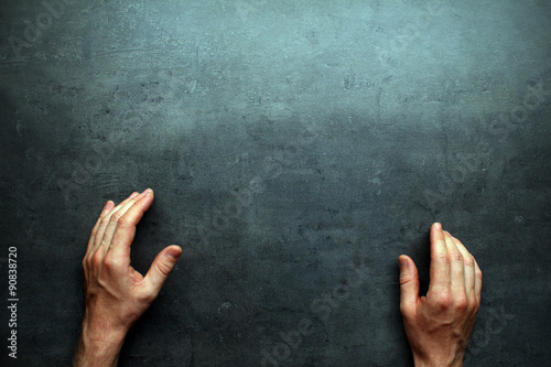 Man hands on grey table background with space for text