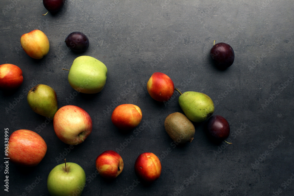 Fresh fruits on grey kitchen table Fresh fruits on grey kitchen table