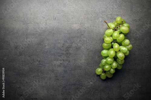 Bunch of grapes on grey kitchen table