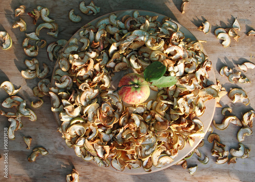 fresh and sliced dried apples scattered on table