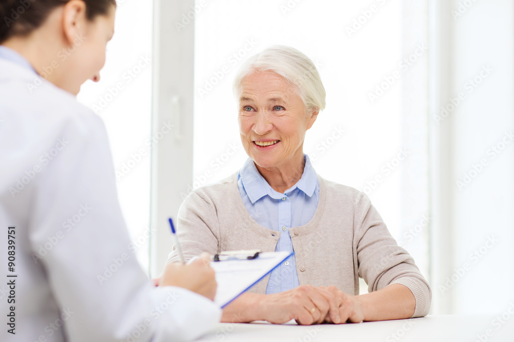 doctor with clipboard and senior woman at hospital doctor with clipboard and senior woman at hospital