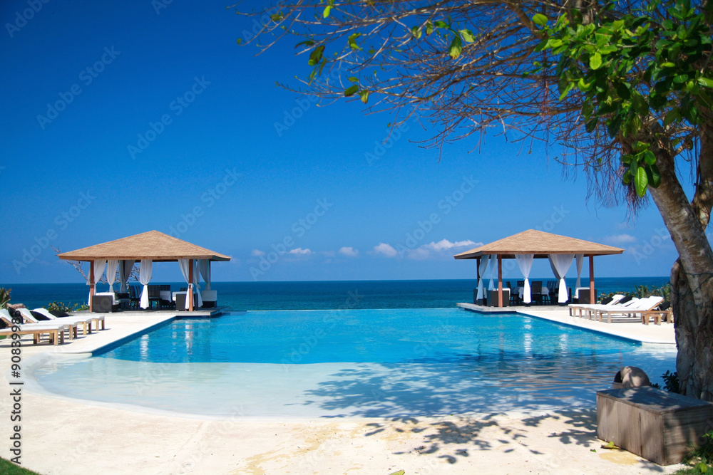 Fototapeta premium Two luxury summerhouses with swimming pool near ocean