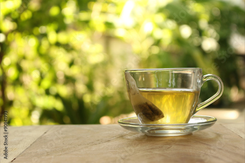 Cup of tea on a blurred background of nature.